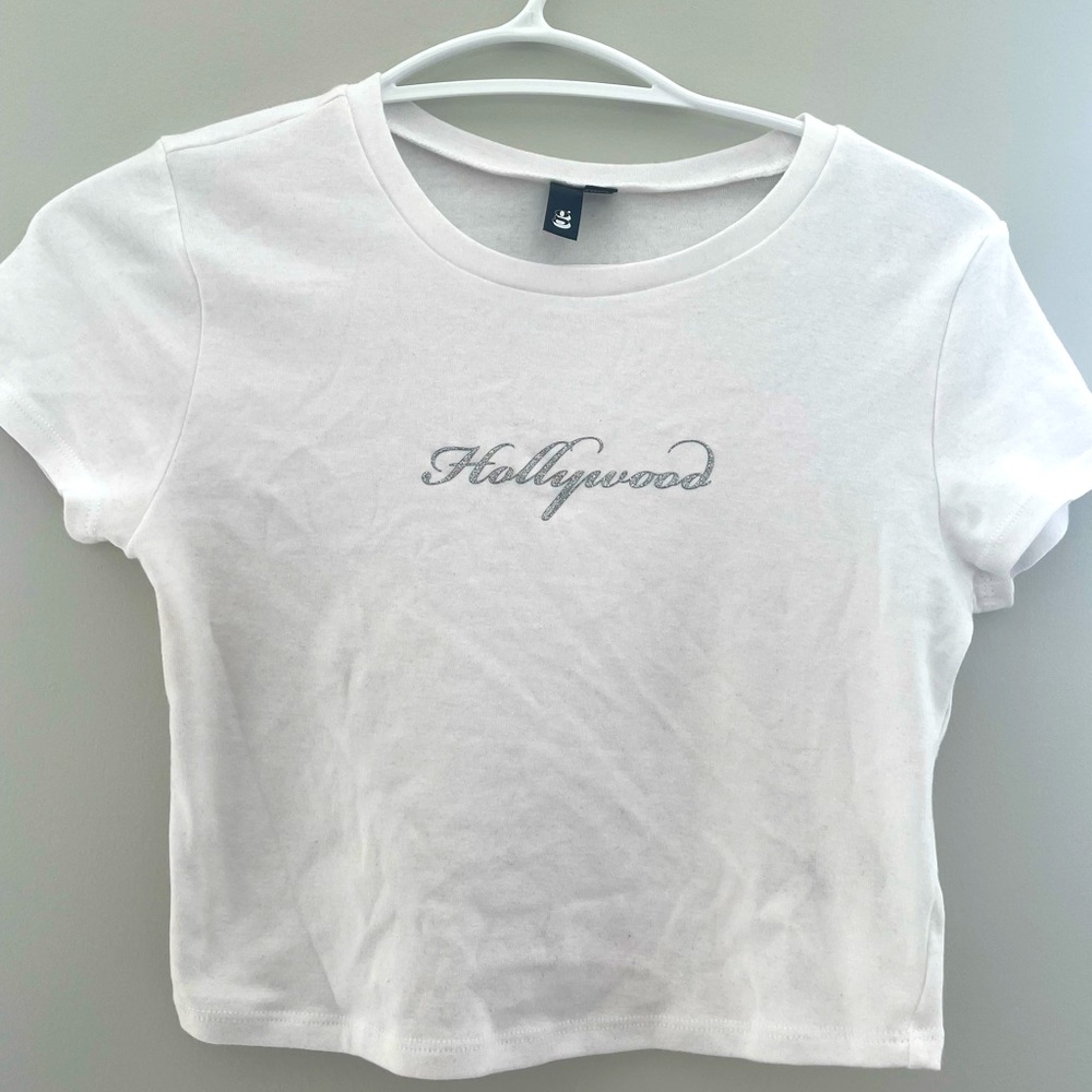 White Garage baby tee with Hollywood written. Size small good condition